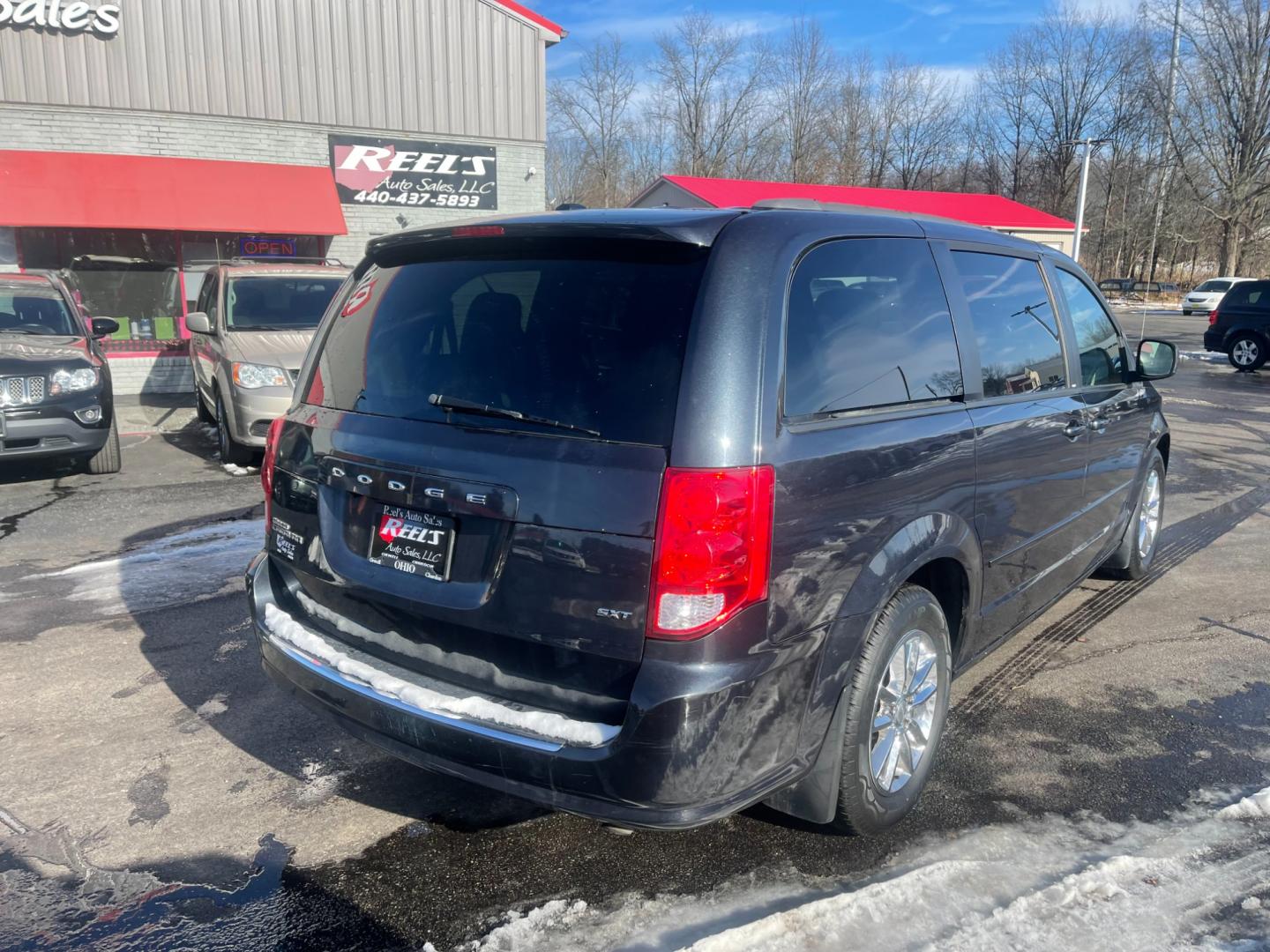 2014 Gray /Black Dodge Grand Caravan SXT (2C4RDGCG9ER) with an 3.6L V6 DOHC 24V FFV engine, 6 Speed Automatic transmission, located at 547 E. Main St., Orwell, OH, 44076, (440) 437-5893, 41.535435, -80.847855 - This 2014 Dodge Grand Caravan SXT is equipped with a rear entertainment system and STOW N GO seating, allowing for easy storage and flexibility. It also features a back-up camera, providing added convenience and safety when parking or reversing. With its versatile seating and entertainment options, - Photo#7